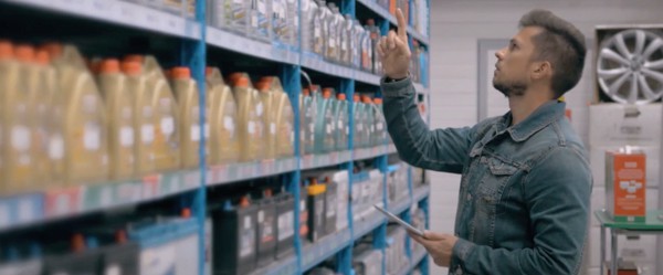 man doing inventory on his business