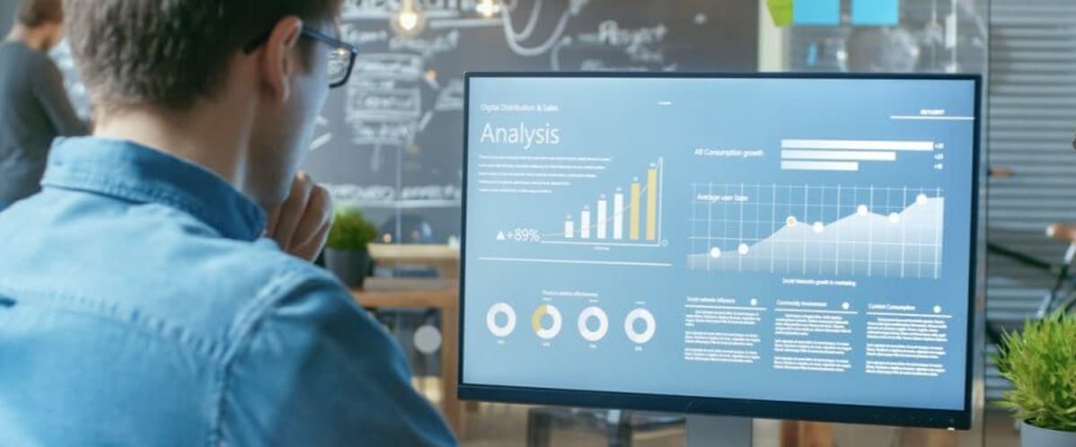 Man Looking at Graphs
